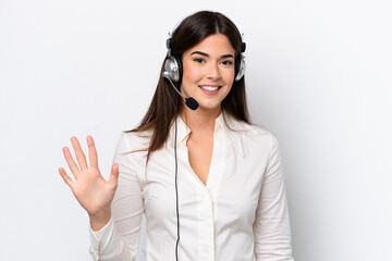 Telemarketer caucasian woman working with a headset isolated on white background counting five with...