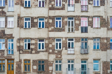 Old house with damaged facade in the city