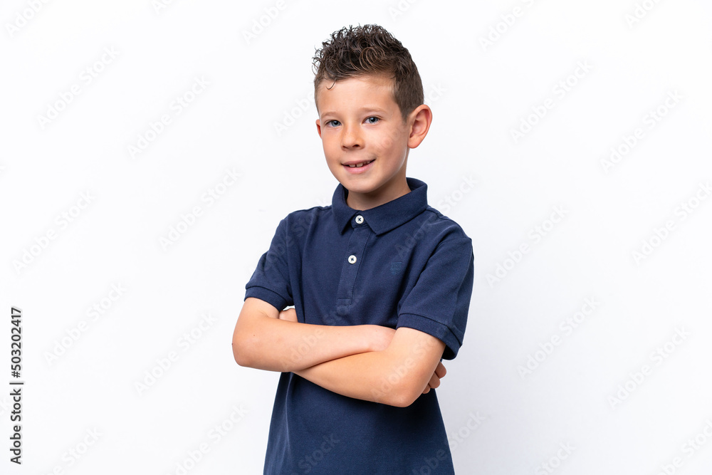 Wall mural Little caucasian boy isolated on white background with arms crossed and looking forward