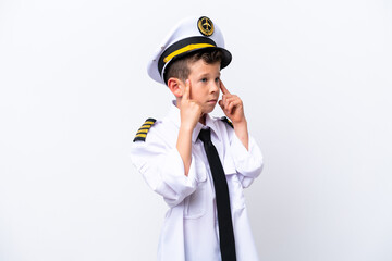 Little airplane pilot boy isolated on white background having doubts and thinking