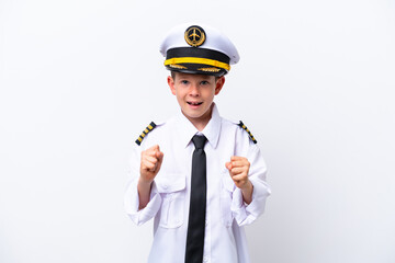 Little airplane pilot boy isolated on white background celebrating a victory in winner position