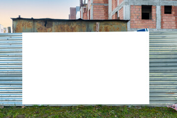 Blank white banner for advertisement on t he fence of construction site