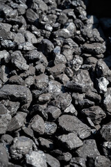 Old-fashioned, non-environmental heating fuel, black rock coal for use in stoking area, air pollution