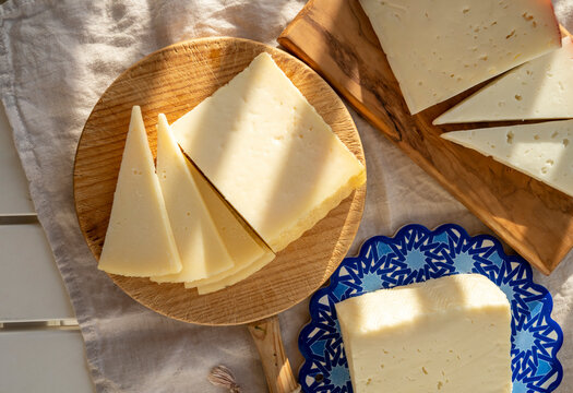 Spanish hard manchego, cow, sheep and goat cheese served outdoor in morning sunlights