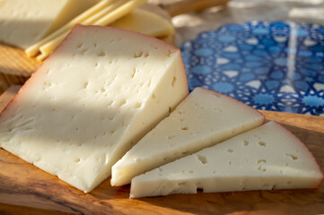 Spanish hard manchego, cow, sheep and goat cheese served outdoor in morning sunlights