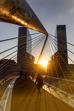 Sunset over Zubizuri bridge in Bilbao, Spain.