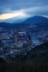 Dusk, twilight over Bilbao city in Basque Country, Spain. Town between mountains.