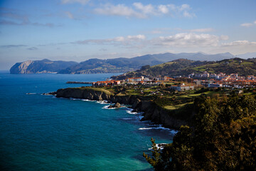 Fototapeta na wymiar Rocky shore with green meadow, aerial view. Bay of Biscay Coast, Northern Spain.