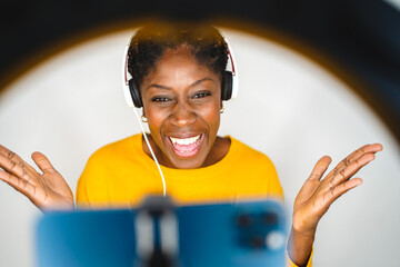 young afro woman laughing making video call