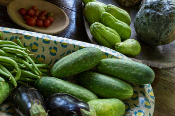 colorful vegetable bowl with chayote, cucumber, eggplant, string beans