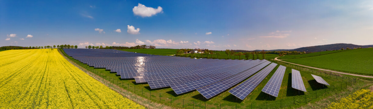 Panoramic view of Solar Park Seßlach, Germany, next to a rapeseed field