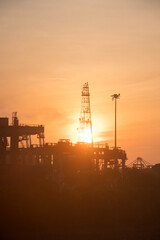 Port cargo terminals and loader cranes in the early morning