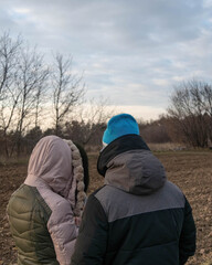Fototapeta na wymiar Male and female refugee lost in the field 