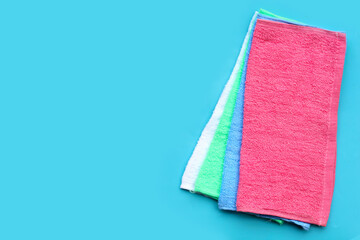 Towel for cleaning on blue background.