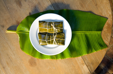 Dominican Pasteles en Hoja is a plantain and tuber dough filled with meat wrapped in plantain leaves. It is similar to Mexican tamales