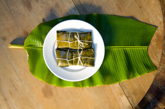 Dominican Pasteles en Hoja is a plantain and tuber dough filled with meat wrapped in plantain leaves. It is similar to Mexican tamales