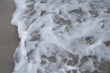 Small wave, Soft wave on sand beach for opening video, text space. white sand beach, Ocean Wave On Sandy Beach