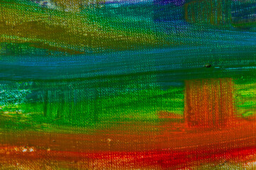 abstract rainbow multicolored background formed by erasing paints from the canvas, short focus. Not an art object, temporary effect.