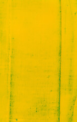 abstract bright colored background: a flat wide spot of yellow paint on a blue fabric close up
