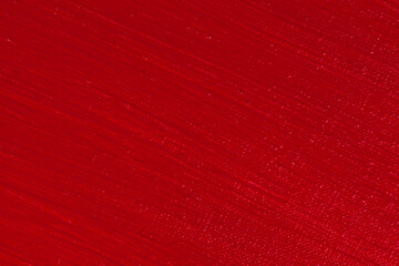 bright red background: thick acrylic paint unevenly on a flat surface