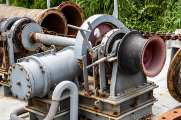 Old rustic abandoned ship anchor machine close up shot