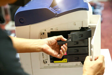 Technician hand open cover photocopier or photocopy to fix paper jam and replace ink cartridges for...