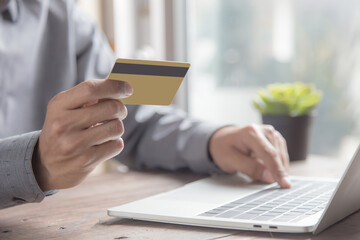 Businessman use credit card to spend money or pay for goods and online services.