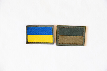 Yellow blue national flag of ukraine and green badge on white background, stop war and peace in...