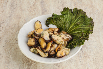 Tasty marinated mussels in the bowl