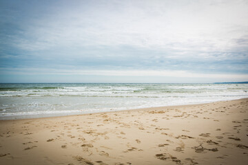 Footsteps in the sand by the sea at Osterlen, Sweden - obrazy, fototapety, plakaty