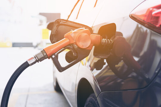 Selective focus Refueling the car with diesel at a gas station.  Car refueling on petrol station. Fuel pump at station