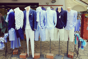 Men clothes in blue and white, trendy dress code of italian and greek islands, outside a fashion...