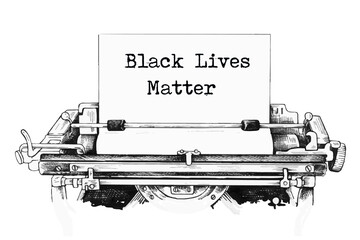 Typing a slogan black lives matter on a vintage typewriter close-up. protest against racism and concept of equal rights