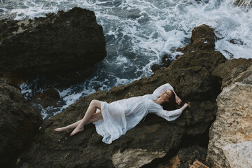 beautiful woman in white wedding dress on sea shore wet hair nature landscape