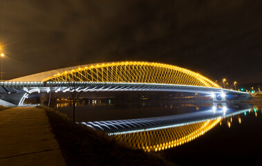 New and modern Troja bridge over Vltava river in Holesovice, Prague, Czech Republic. Summer, at night.