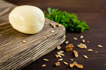 Goat cheese and fresh vegetables in the kitchen, juicy tomatoes, onions