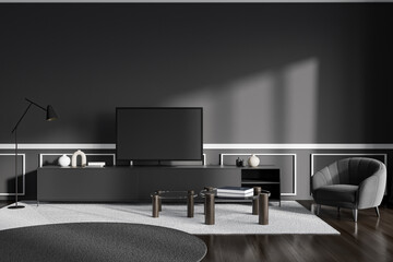 Grey chill room interior with tv set on drawer, armchair on wooden floor
