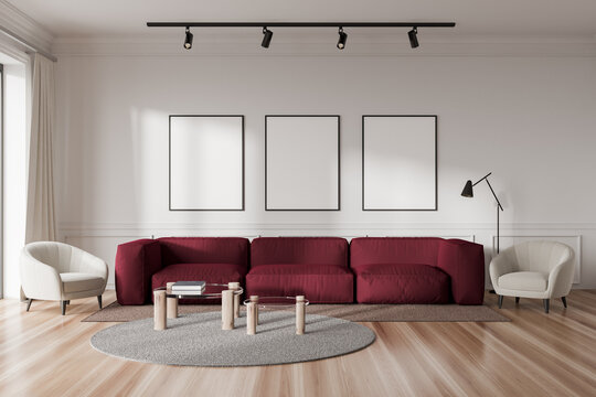 Living room interior with couch and armchair, mockup frames