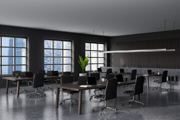 Office interior with computer and armchair in row, panoramic window on city view