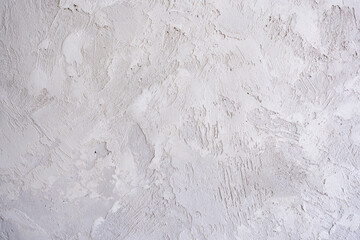 artistic plaster on a gray and white wall. Repairs. elements of wall decor. copy space. texture. background.