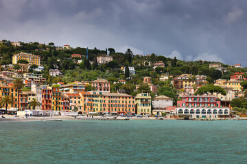 Fototapeta na wymiar Summer view of Santa Margherita Ligure in Liguria. Panoramic view with colorful houses of the ligurian riviera.