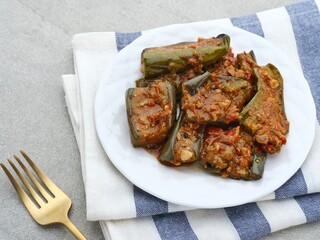 Terong balado, Terong sambal balado or balado eggplant sauce, traditional food from Indonesia. Selective focus image.

