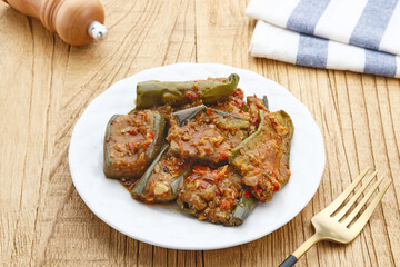Terong balado, Terong sambal balado or balado eggplant sauce, traditional food from Indonesia. Selective focus image.
