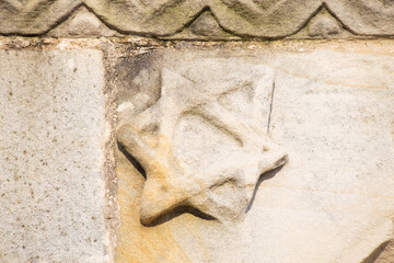 Star of David carved in stone in a Romanesque church. Santa María de la oliva, in Villaviciosa,...