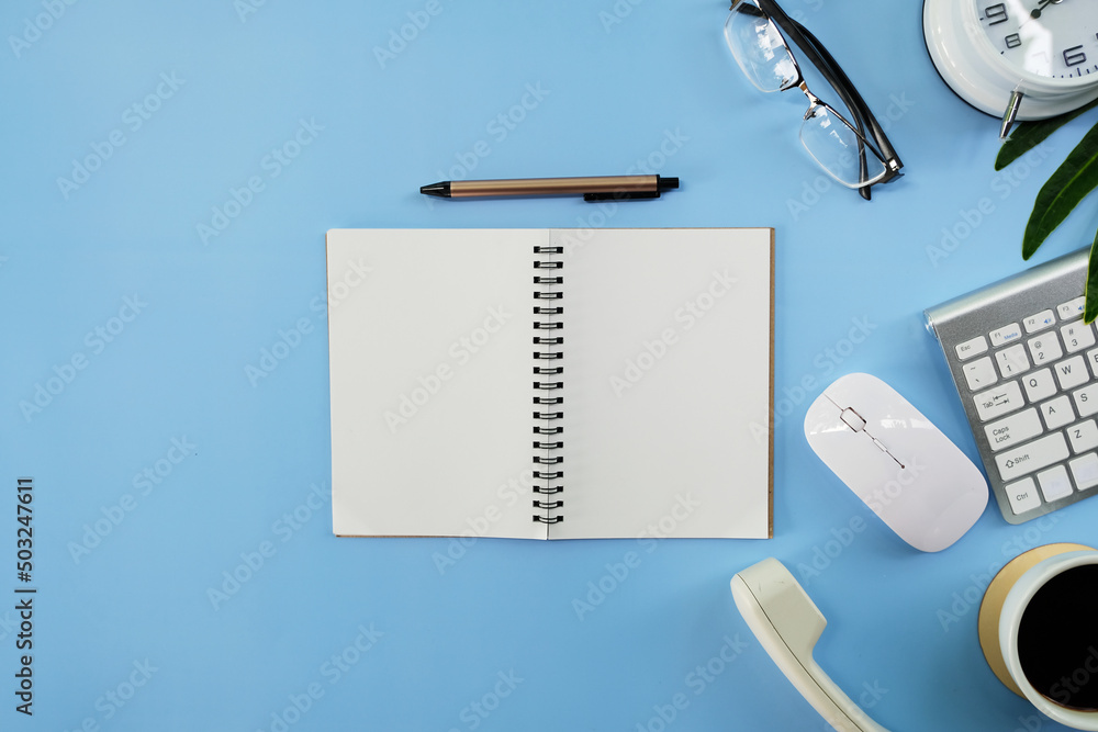Poster office desk table with smartphone, laptop computer, cup of coffee and supplies. top view with copy s