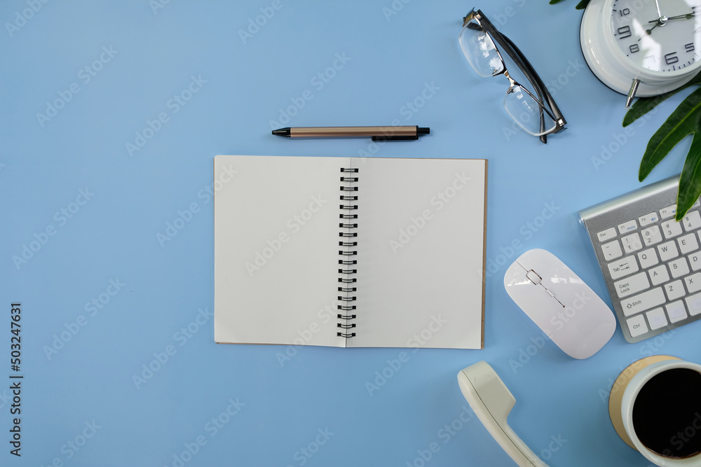 Poster concept of a home office and working from home. tabletop workspace with laptop computer and notepad 