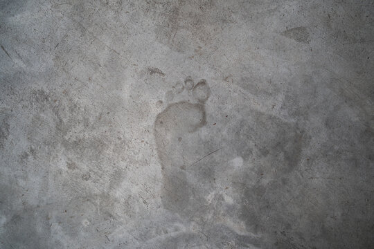 Concrete texture with left human footprint