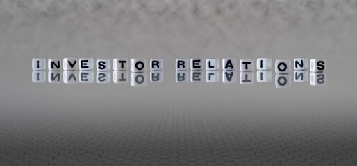 investor relations word or concept represented by black and white letter cubes on a grey horizon background stretching to infinity