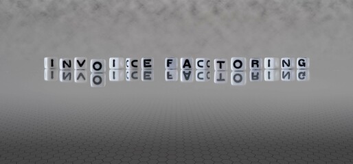 invoice factoring word or concept represented by black and white letter cubes on a grey horizon...