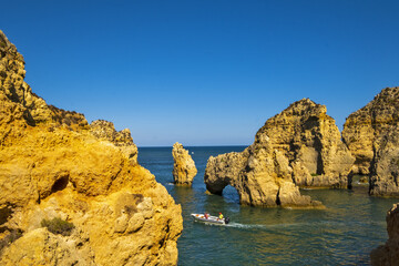 Fototapeta na wymiar Panoramic view with Cliff, rocks and emerald sea at Ponta da Piedade near Lagos, Algarve, Portugal